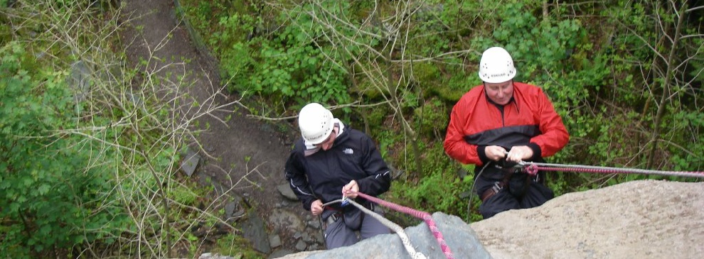 Abseiling with a friend can add to your fun in The Lake District.